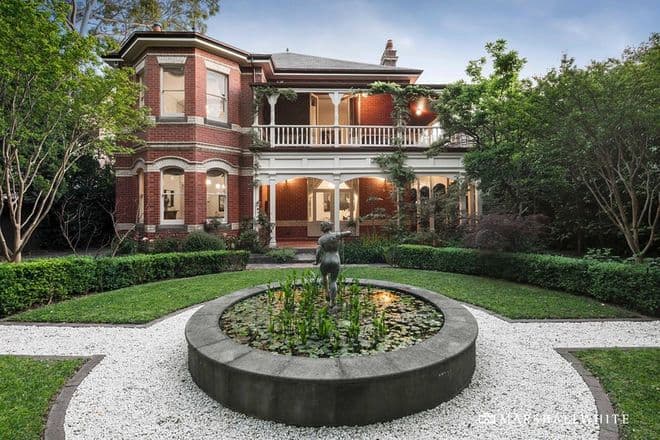 Grand period home facade in soft grey with white columns